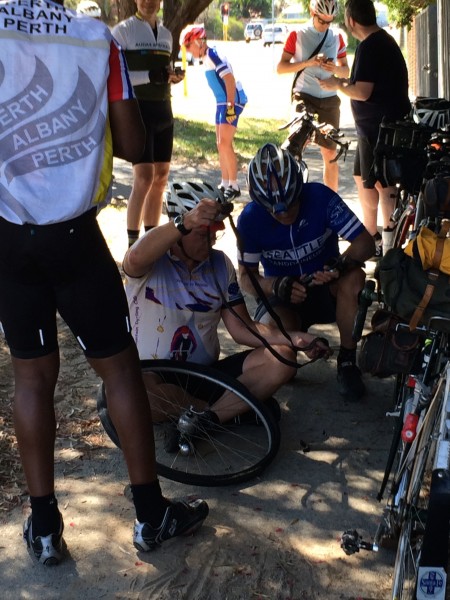 How many randos does it take to fix a flat? Flat # 3. Pre-ride to Freo. photo: Banks